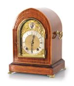 An early 20th century mantel clock, the W&H Sch. movement striking on two gongs, the silvered 4.5
