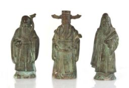 A set of three Chinese bronze rank figures modelled as Lu Xing and court officials/scholars, h. 24