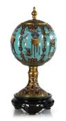 A Chinese cloisonne vase and cover of ball form, the melon shaped body on a shaped stem and foot,