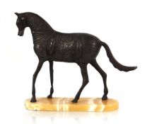 A brown-patinated sculpture modelled as a Tang-style horse, on a striated marble plinth, h. 25 cm,