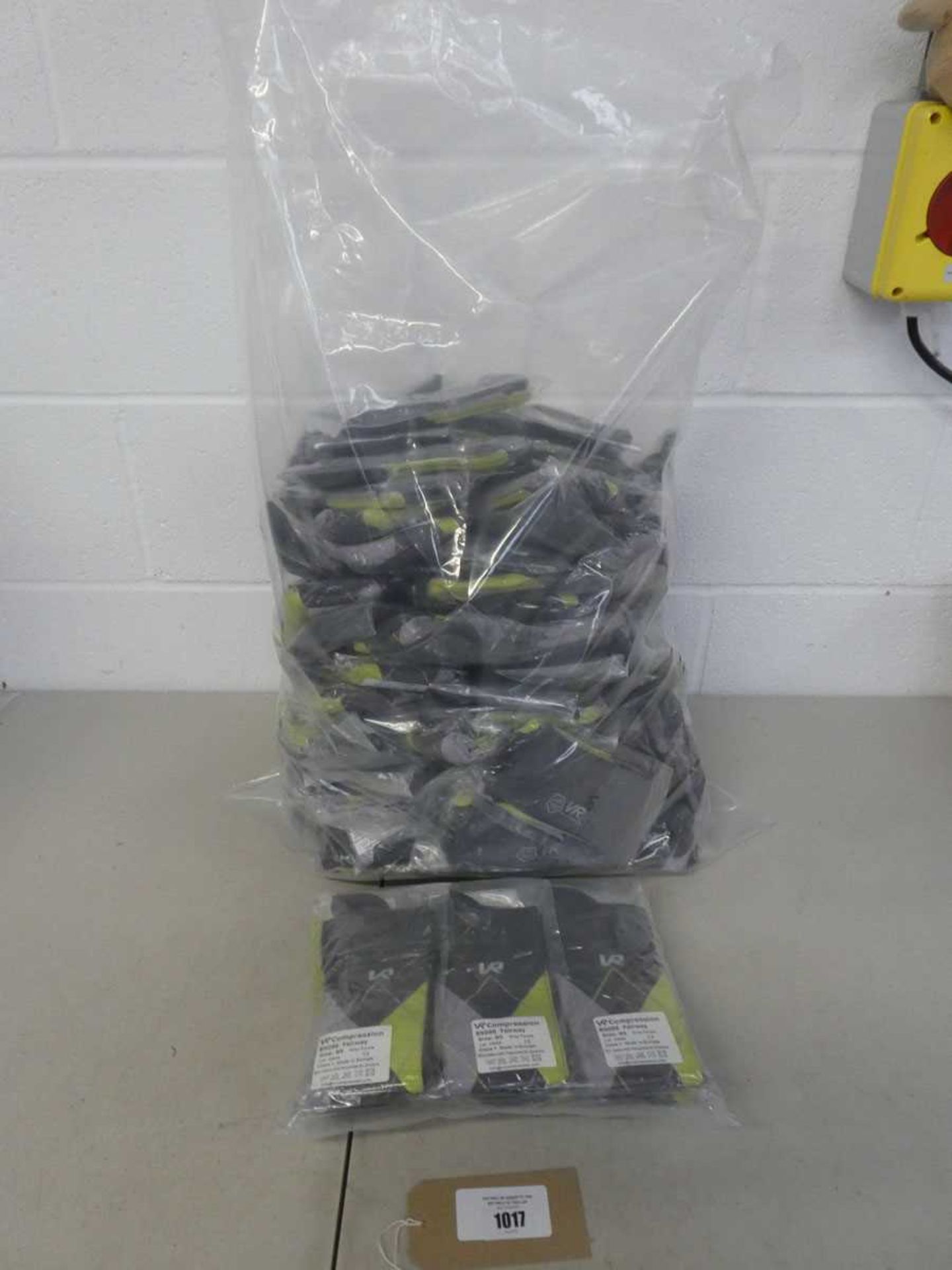 +VAT A bag containing approx. 100 pairs of VR Compression socks in grey/purple.