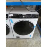 +VAT Haier Direct Motion washing machine in black and white