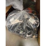 Bag containing various charging plugs, phone cases, batteries etc