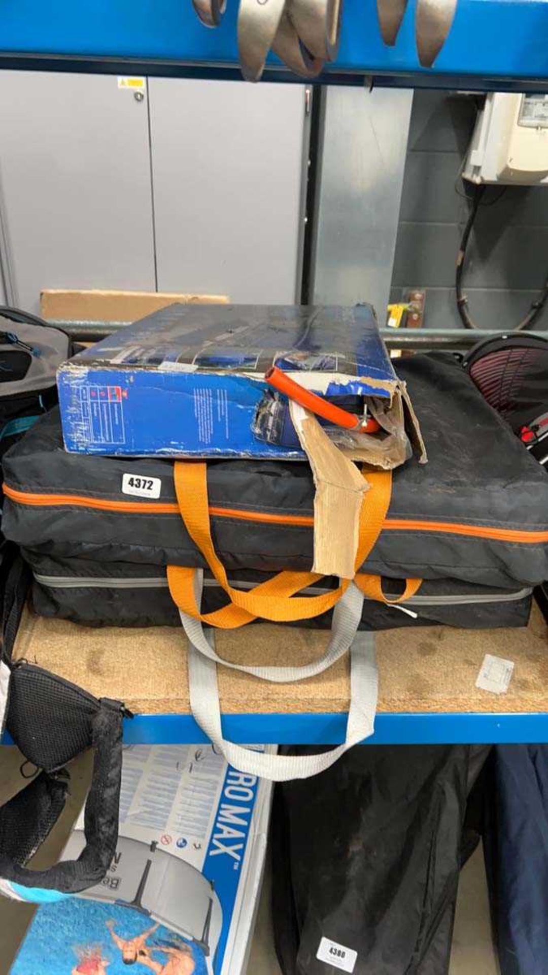 Two three shelf fold up cupboards plus a mini folding camping grill