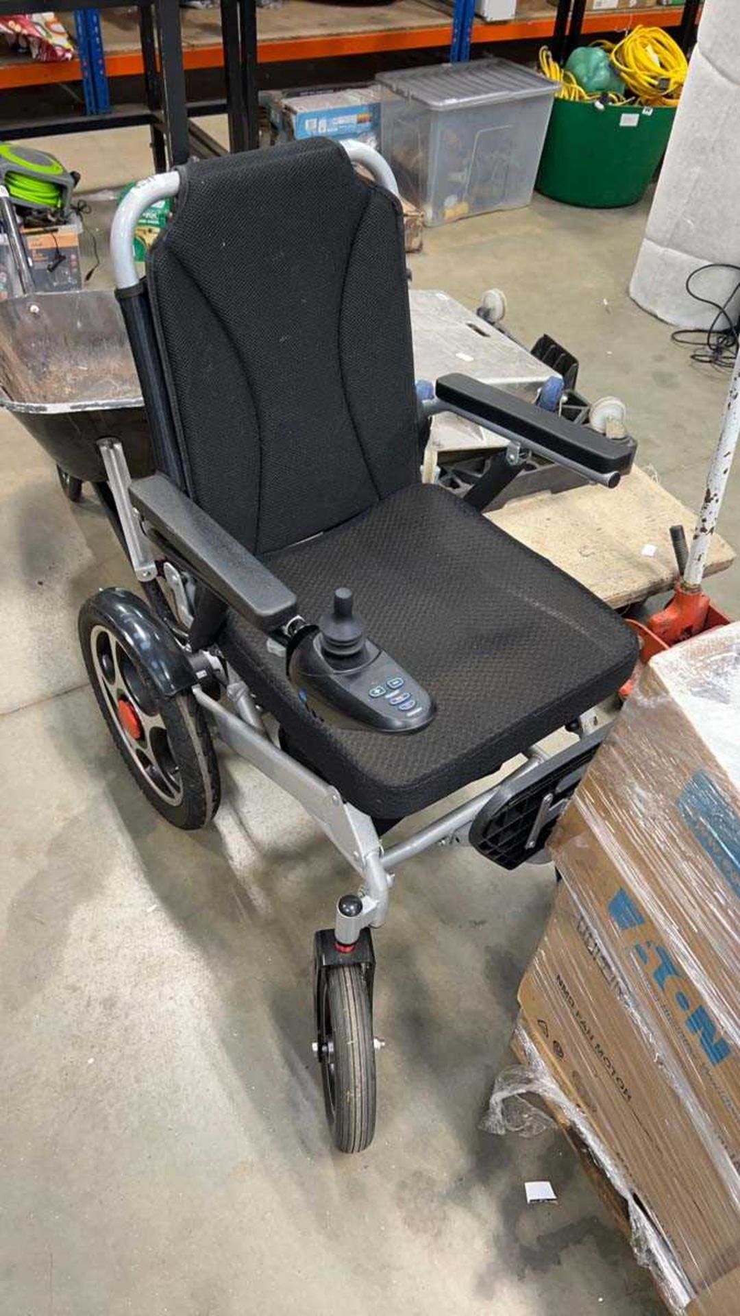 Four wheeled electric mobility chair