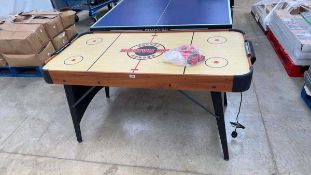 Air Raider air hockey table with bag of associated accessories