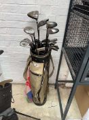 Gold and black golf bag containing a quantity of mix branded golf clubs to include Cobra XL