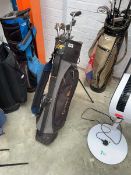 Golden Bear branded golf bag containing a quantity of Golden Bear branded golf clubs
