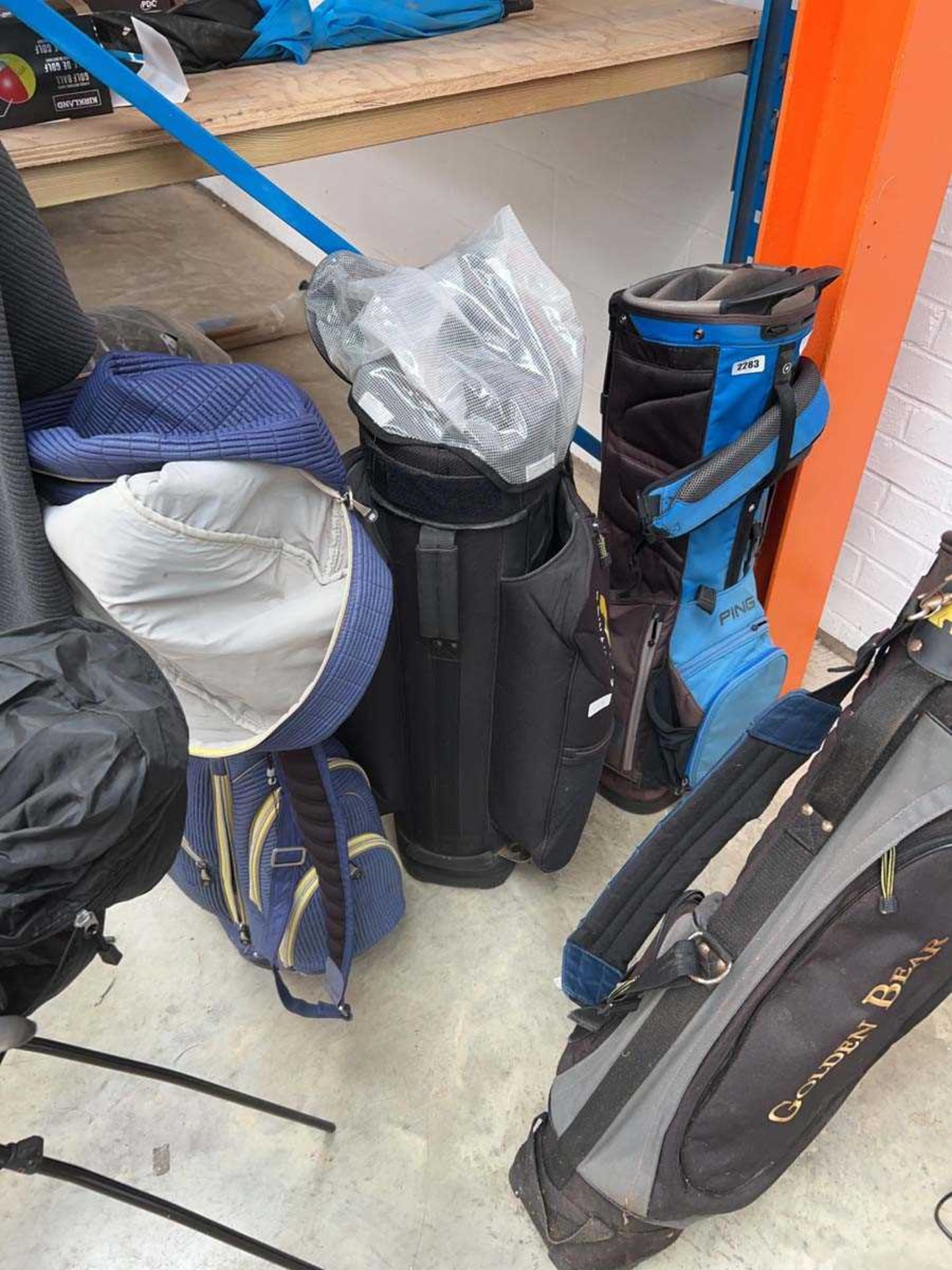 Vintage Ouul branded blue and yellow golf bag, together with a Powa Kadd cart bag and a Ping black