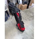Wilson branded red and black golf bag containing a quantity of mainly Prosimmon branded golf clubs
