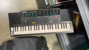 Yamaha PSS280 keyboard, plus music books and backpack