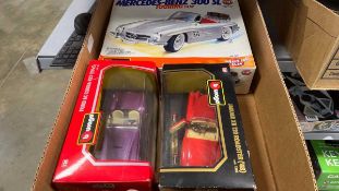 Box of diecast Burago cars - Ford AC Cobra 427 1965, Jaguar XK12 Roadster (48), Mercedes-Benz