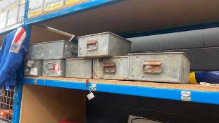 Seven metal storage crates