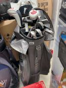 MotoCaddy golf bag containing Cleveland Launcher woods and irons (with new grips)