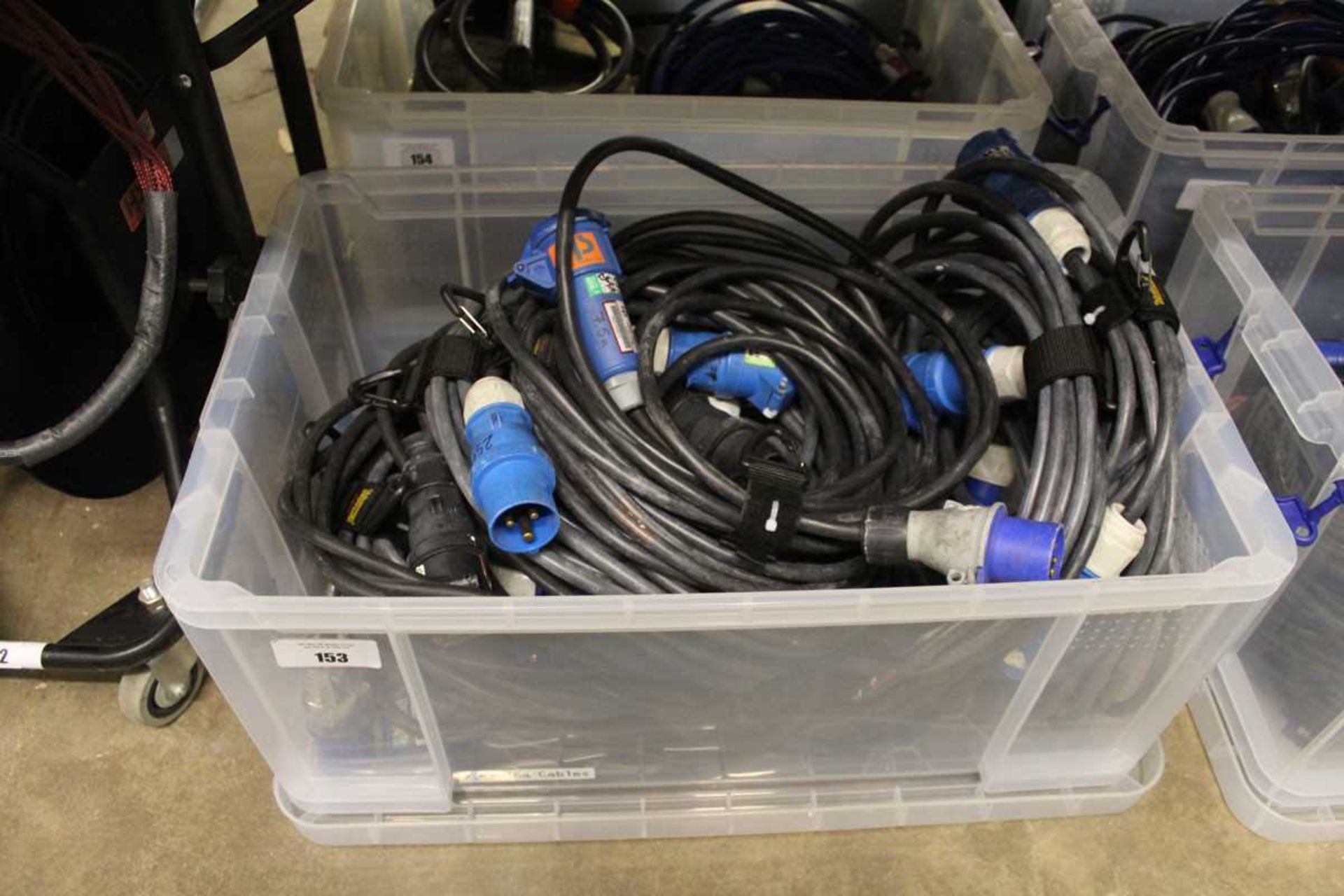 +VAT Plastic crate containing approximately ten 240V extension power cables 16Amp