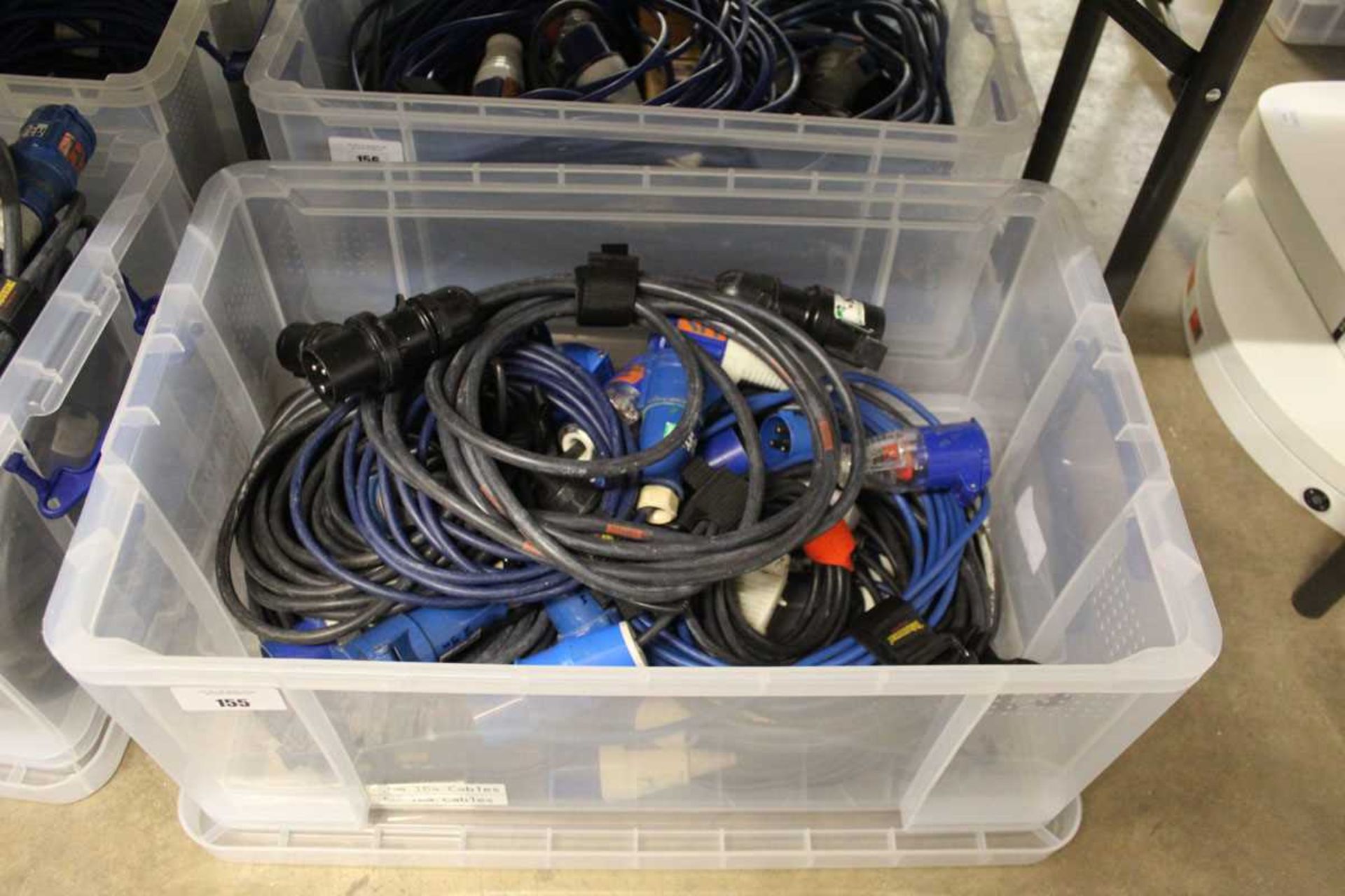 +VAT Plastic crate containing approximately ten 240V extension power cables 16 Amp