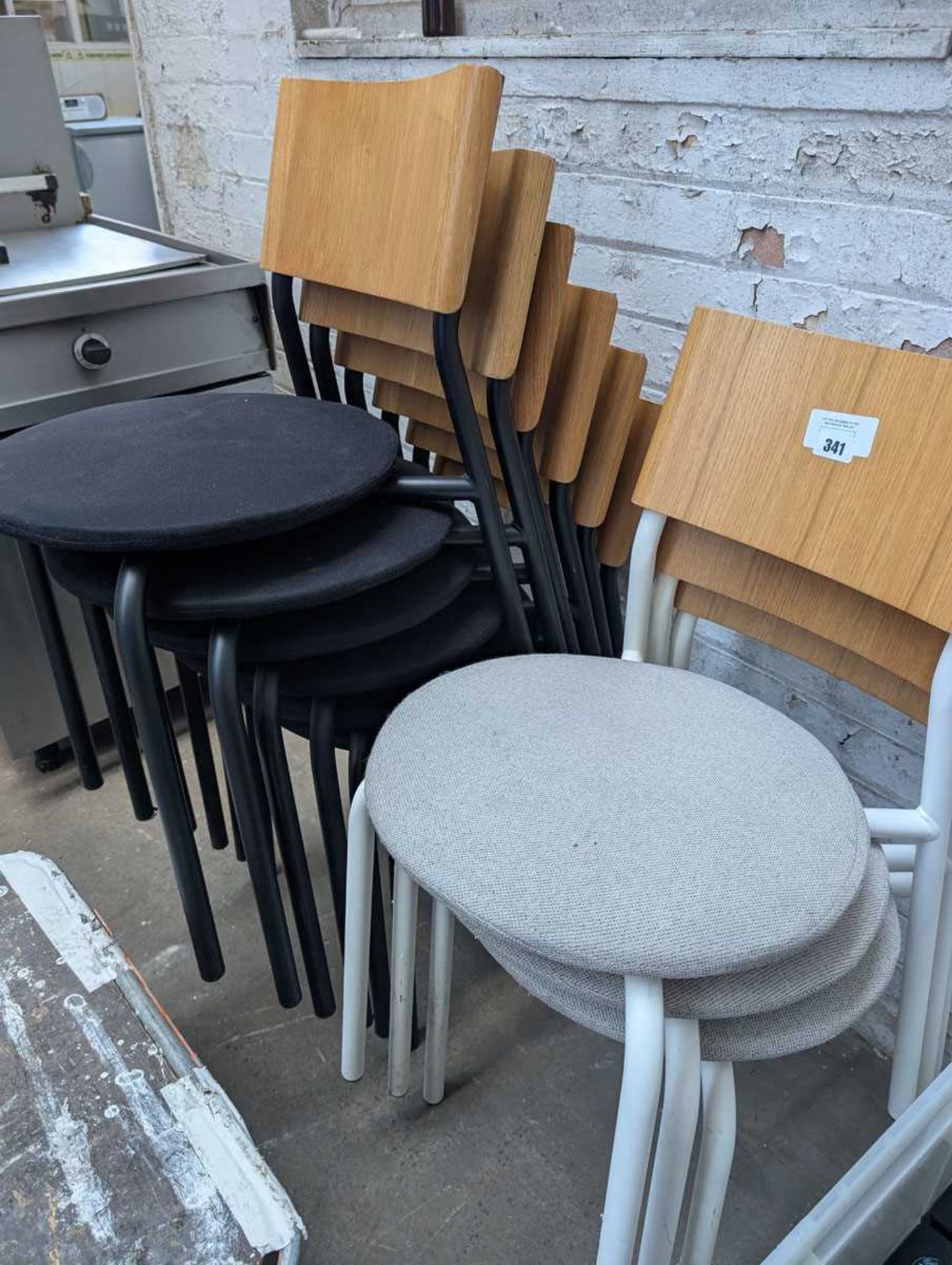 +VAT 5 Tip Toe black stacking chairs and 3 Tip Toe cream stacking chairs