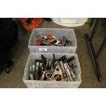 +VAT Two plastic crates containing various clamps