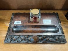 Carved oak ink stand with glass ink well