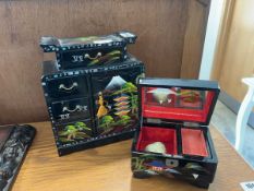 Black lacquer finish jewellery box with hand painted decoration together with a further similar
