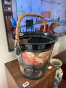 Metal bucket with wicker handle, the bucket painted in a narrow boat art fashion