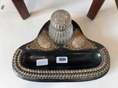 Decorative ink well on ebony coloured stand with applied brass decoration