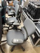 Set of three dark grey upholstered twin armed office armchairs on five star bases