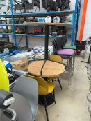 Grey circular table on metal base together with a pair of grey composite dining chairs together with