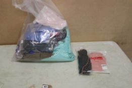 +VAT Bag of assorted dance clothing to include stirrup leggings, long sleeve wraps, shiny shorts and