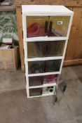 +VAT 5 tiered plastic storage unit with contents to include children's sandals, leotards, men's
