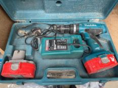 Makita cordless drill with 2 batteries and a charger