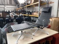 +VAT Charles & Ray Eames for Vitra, an EA124 lounge chair with headrest upholstered in black leather