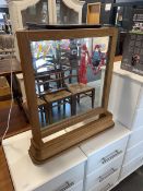 Modern light oak framed mirror with uplight