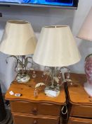Floral pair of white and gilt table lamps with cream coloured shades