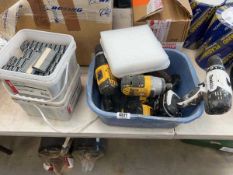 Crate containing Dewalt impact driver, Dewalt drill, Snap-on impact driver, Makita drill (some