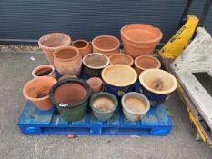 Pallet with various sized terracotta plant pots