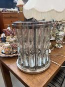 Brushed metal and glazed candle holder