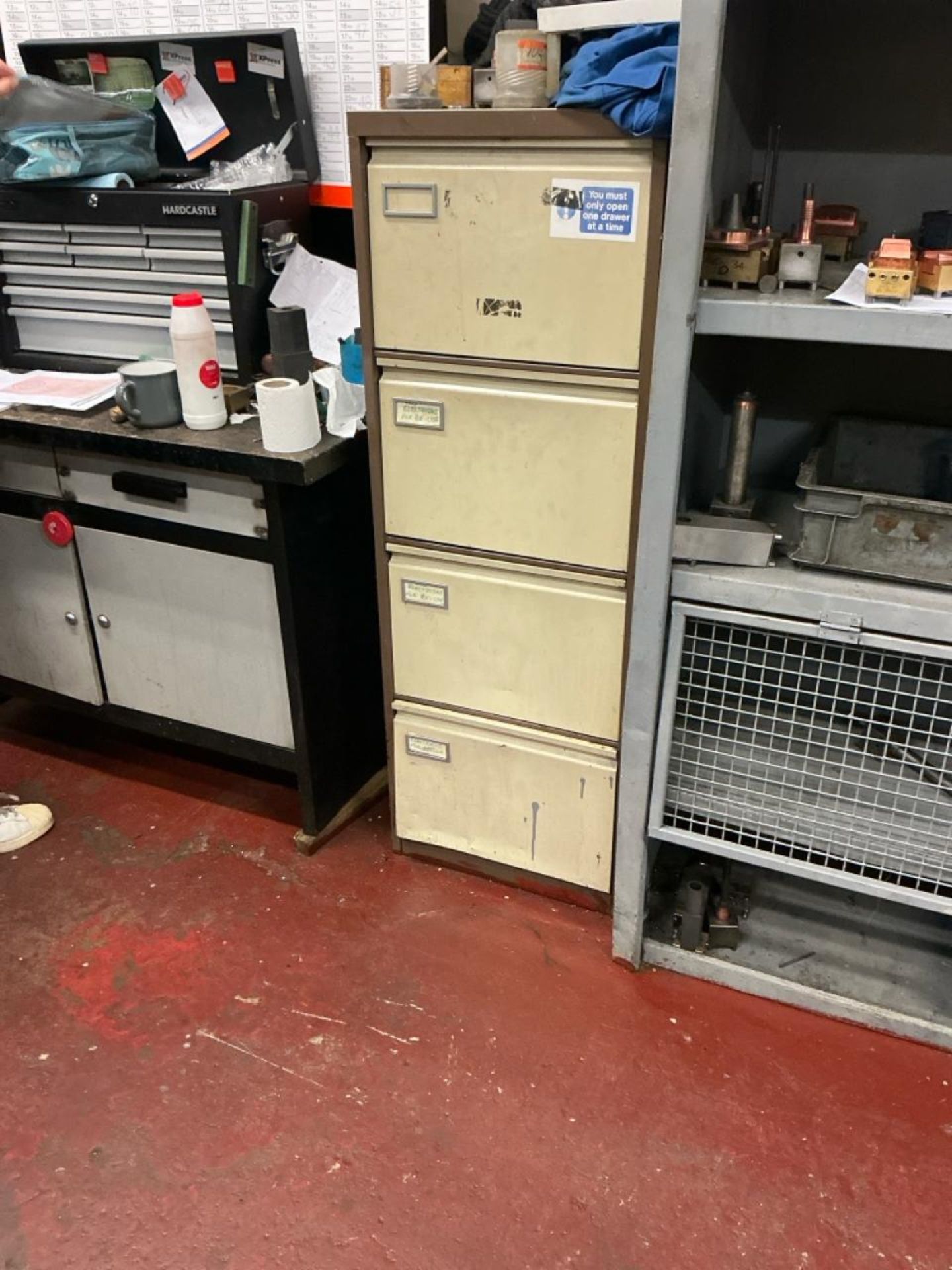 2 x two tone brown four drawer filing cabinets and one low two tone brown double door cupboard