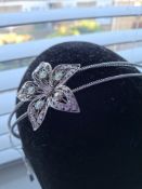 Title: Designer Headband With Large FlowerDescription: Unused silver colour tiara/headbandRRP £