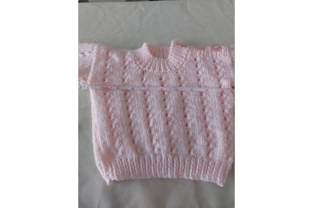 Title: Hand Knitted Baby JumperDescription: Stunning baby jumper in pink. Hand knitted. Â  Fastens - Image 1 of 5
