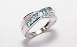 This Twist On A Classic Ring Is Stunning. Seven Beautiful Princess Cut Blue Topaz Gemstones