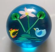 A Charming Mid Century, Folk Art, Spherical Art Glass Paperweight Featuring A Whimsical Aquatic P...