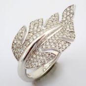 An exquisite leaf ring intricately detailed with brilliant diamonds and 18k