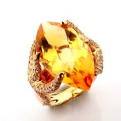 An exquisite 18k rose gold ring with citrine and brilliant