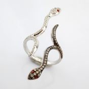 Snake ring , detailed with brilliant diamonds and 18k