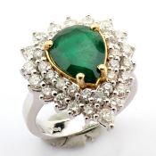 18K White gold cluster ring detailed with vibrand emerald and pear and brilliant