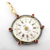 An exquisite pendant made of gold and silver, featuring an antique watch dial adorned with
