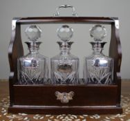 Vintage Mahogany Three Bottle Cut Crystal Tantalus with Silver Plated Mounts