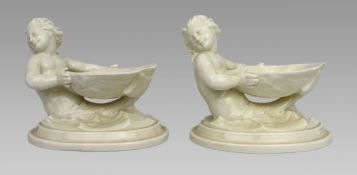 Pair of Royal Worcester Blanc de Chine Merchild Salt Cellars