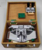 Vintage Nikon optical instrument in fitted wooden carrying case.